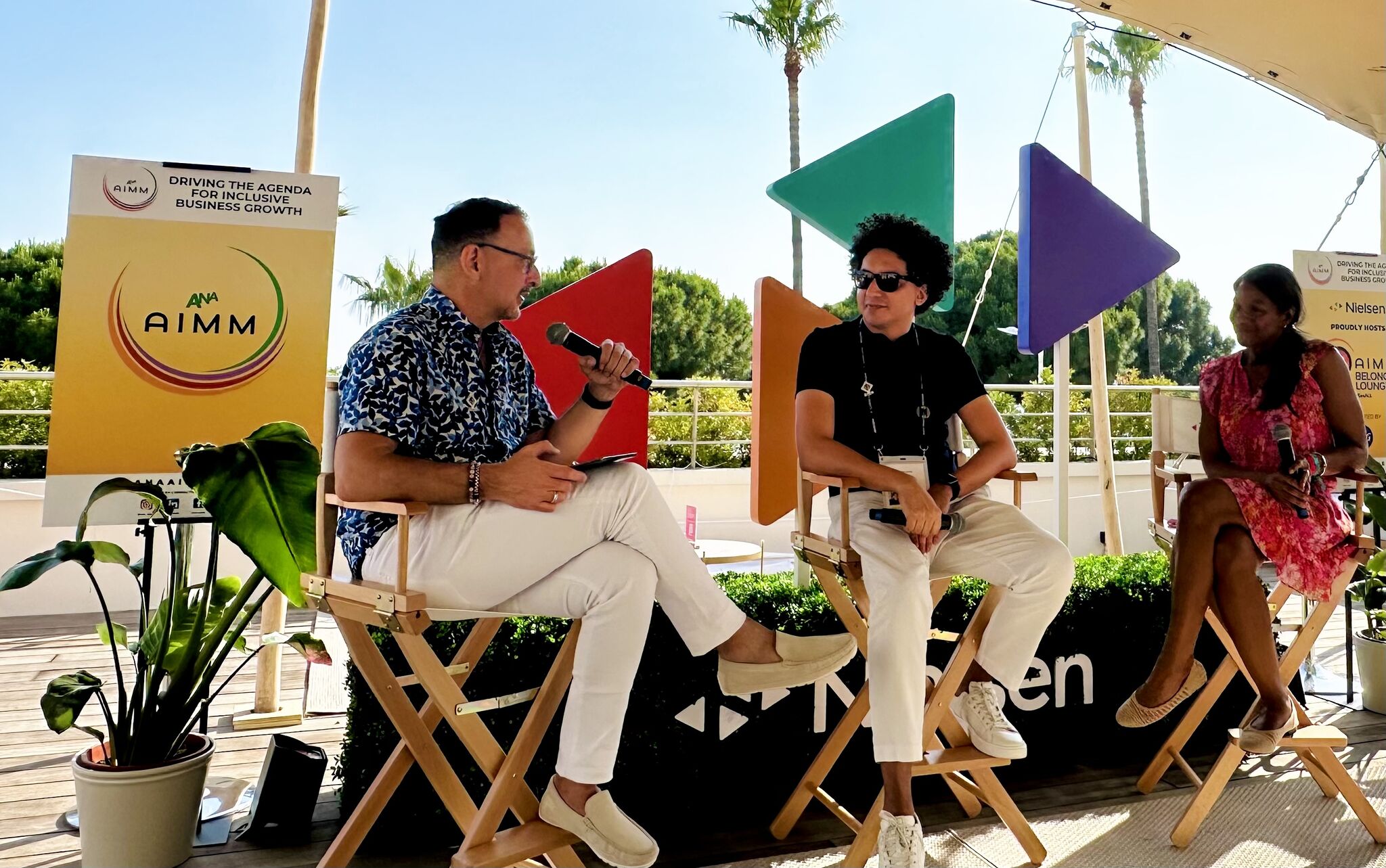 (from left to right) Carlos Santiago speaking with Alex Miranda (KNOCK Inc) and Tammy Johnson (Alpha Precision Media)